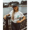 Girl wearing a navy baseball hat with Bateau restaurant logo